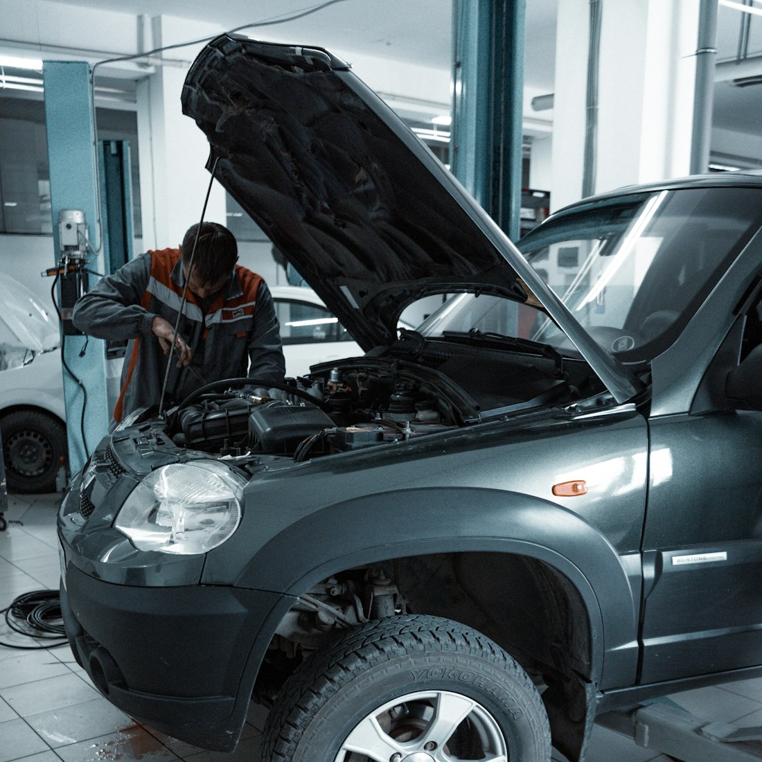 Working under the hood of a vehicle